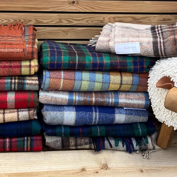 The Highland Range of Recycled Wool Mix Tartan Check Plaid Blankets, available in 14 colourways
