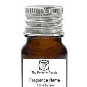 May include: A small brown glass bottle with a silver lid. The bottle has a white label with black text that reads "The Perfume People" and "Fragrance Name". The label also includes the text "2.5ml Sample".