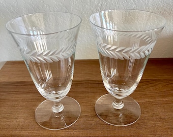 Vintage pair Fostoria footed juice glasses in the Laurel Wreath pattern 1950s