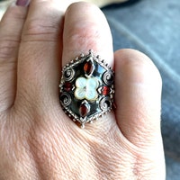 Масивное колцц з золота, серебра и гранquisi