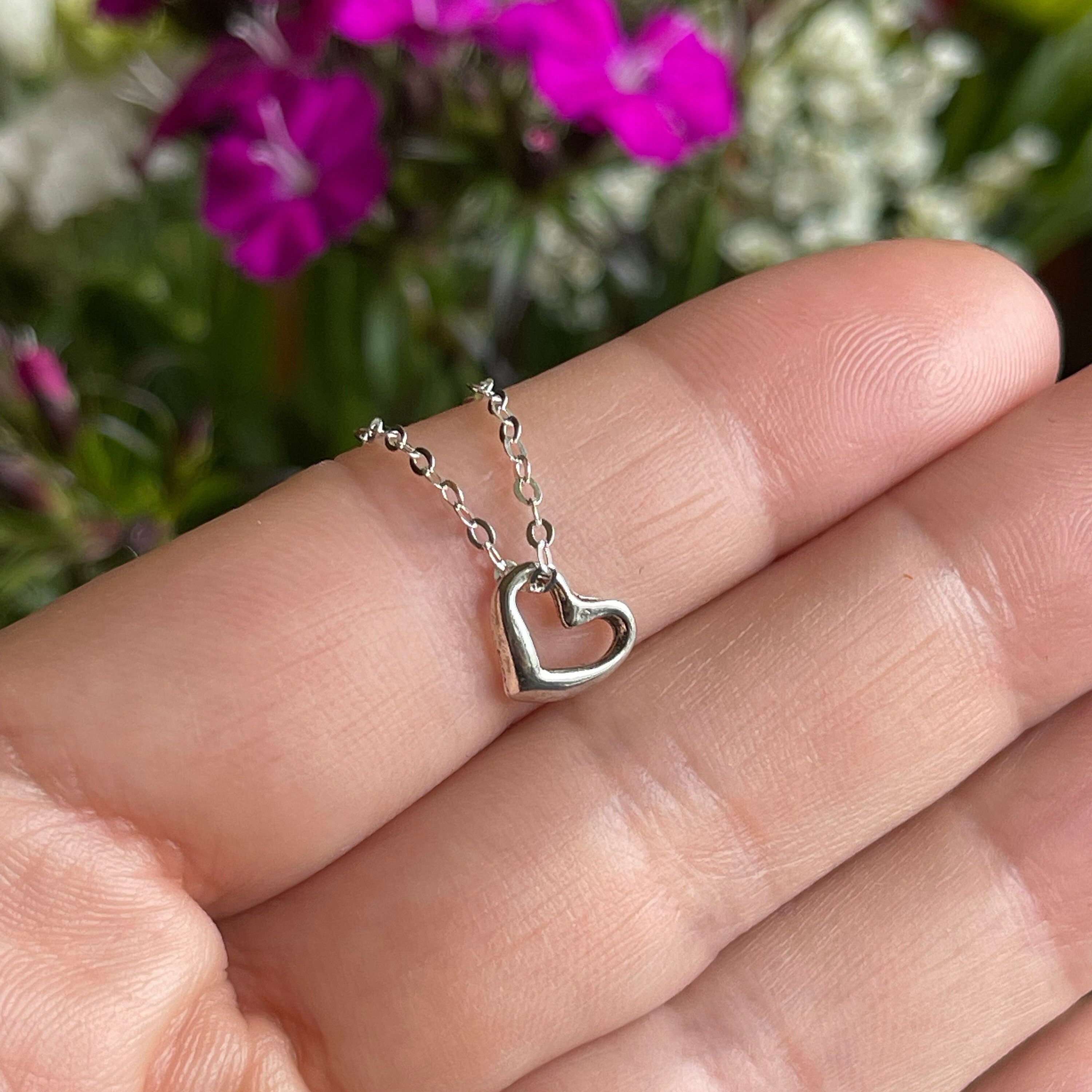 Tiny silver heart best sale necklace