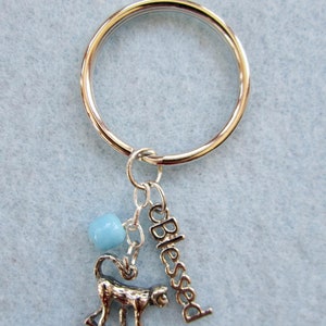 Key Ring with Monkey Charm, Turquoise Round Bead, and the word &quot;Blessed&quot;