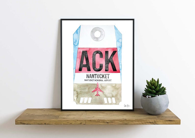 May include: A watercolor painting of a luggage tag with the airport code "ACK" and the text "NANTUCKET NANTUCKET MEMORIAL AIRPORT".