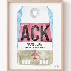 May include: A watercolor painting of a luggage tag with the airport code "ACK" for Nantucket Memorial Airport. The tag is red, white, and blue with a small airplane illustration.