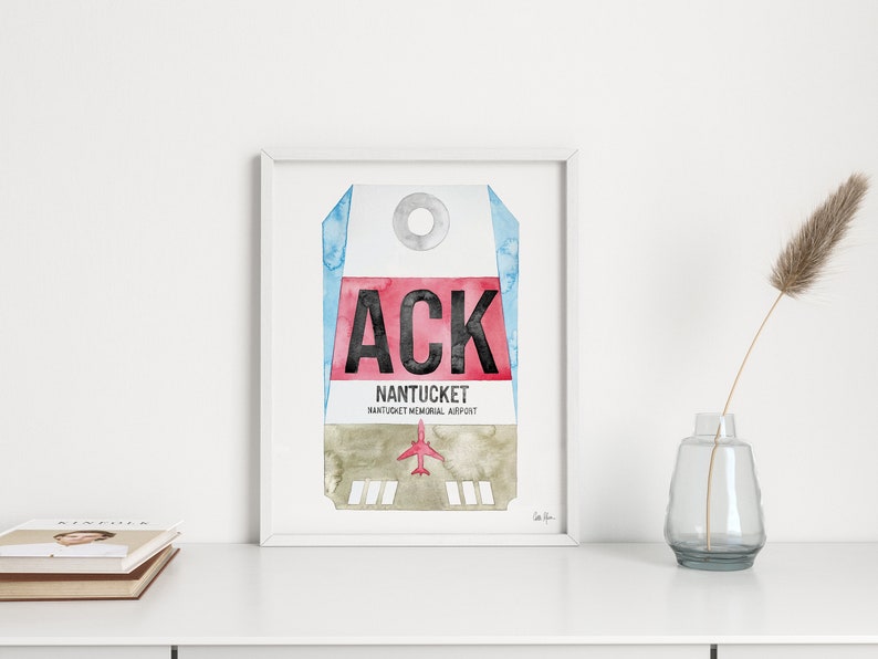May include: A watercolor painting of a luggage tag with the airport code "ACK" and the text "NANTUCKET NANTUCKET MEMORIAL AIRPORT".