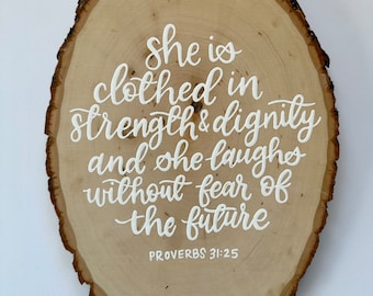 Hand painted wood round // she is clothed in strength and dignity and she laughs without fear of the future