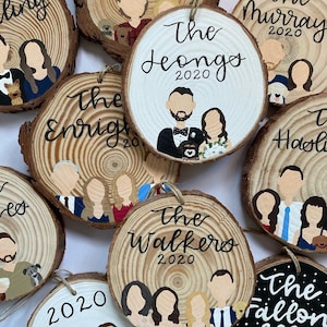 May include: A collection of personalized wood slice ornaments with painted portraits and names. The ornaments feature various family names, including "The Leongos 2020", "The Enrights 2020", "The Walkers 2020", and "The Fallon 2020".