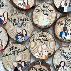 May include: A collection of 10 round wooden ornaments with painted family portraits and names. Each ornament features a different family name, a year, and a painted portrait of the family members. The ornaments are painted in various colors, including brown, black, white, red, blue, and yellow.