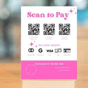 May include: A pink and white sign with the text "Scan to Pay" and QR codes for Cash App, Venmo, and PayPal. The sign also lists other payment methods accepted, including Mastercard, Google Pay, Visa, Cash, and Credit Card. The sign also includes the text "Connect with us" with a website address and social media handle.
