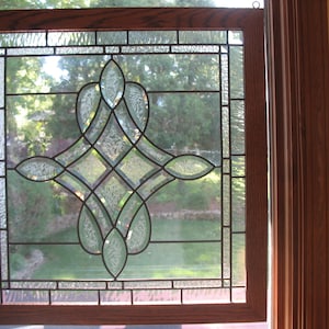 Beautiful beveled, leaded glass window in oak frame