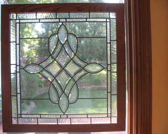Beautiful beveled, leaded glass window in oak frame