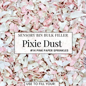 May include: A close-up of pink and white paper sprinkles labeled "Pixie Dust" for sensory bins. The text on the label reads "#14 Pink Paper Sprinkles" and "Use to fill your: Garden, Candy, Valentine Bins."