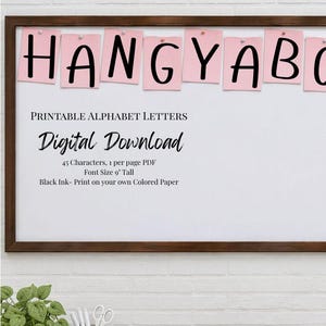 May include: A bulletin board with pink paper squares displaying black letters spelling HANGYABC. Text includes BULLETIN BOARD PRINTABLES FROM Cotton N' Kandi, PRINTABLE ALPHABET LETTERS, Digital Download, 45 Characters, 1 per page PDF, Font Size 22.86 cm Tall, Black Ink- Print on your own Colored Paper.
