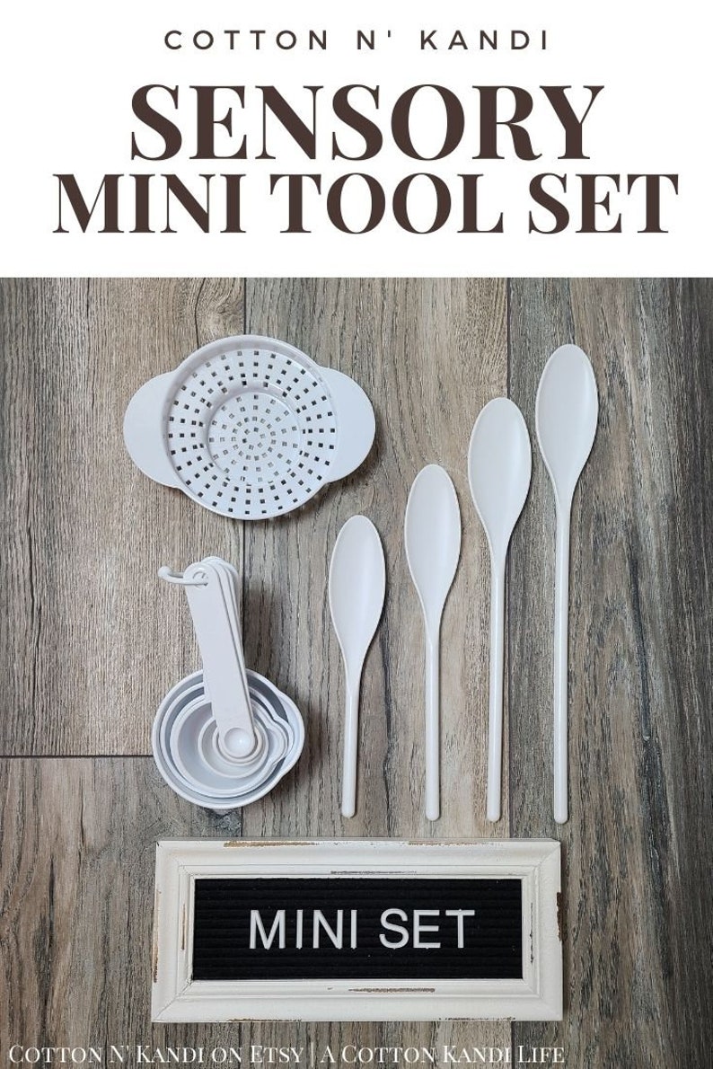 May include: White sensory tools for children, including a colander, measuring cups, and spoons. The tools are arranged on a wooden surface with a sign that reads "MINI SET".