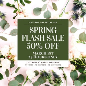 May include: A green and white graphic with the text "Spring Flash Sale 50% Off" and "March 1st 24 Hours Only". The graphic is surrounded by white flowers and green leaves.