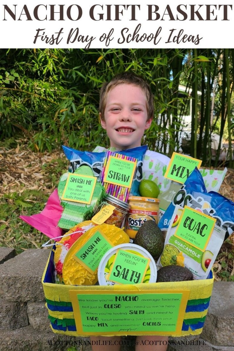 May include: A yellow and green gift basket filled with snacks and a variety of items with labels that say "Smash Me", "When You're Feeling Salty", "Your Happy Mix", "Straw", and "Guac". The basket is decorated with yellow, blue, and green streamers. The text on the basket reads "We know you're Nacho average Teacher, but just in Queso you need us, we're here. When you're feeling Salty and need to Taco 'bout something just call. Find your happy Mix and remember Cactus makes me happy."