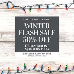 May include: A graphic with a winter sale announcement. The text reads "READY TO SHIP ITEMS ONLY", "WINTER FLASH SALE 50% OFF", "DECEMBER 1ST 24 HOURS ONLY", "COTTON N' KANDI ON ETSY", and "READY TO SHIP ITEMS ONLY". The graphic is surrounded by a string of colourful Christmas lights.