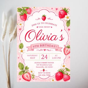 May include: A pink birthday invitation with a strawberry theme. The invitation features the text "Olivia's 9th Birthday!" and includes details such as the date, time, and location. Strawberries and flowers decorate the border.