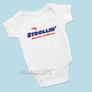May include: White baby onesie with a blue and red logo that says "Strollin' Around the World".