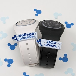 May include: Two white and black Mickey Mouse wristbands with a Mickey Mouse head design. The white wristband has a blue label that says "College Program" and the black wristband has a blue label that says "DCP Parent".