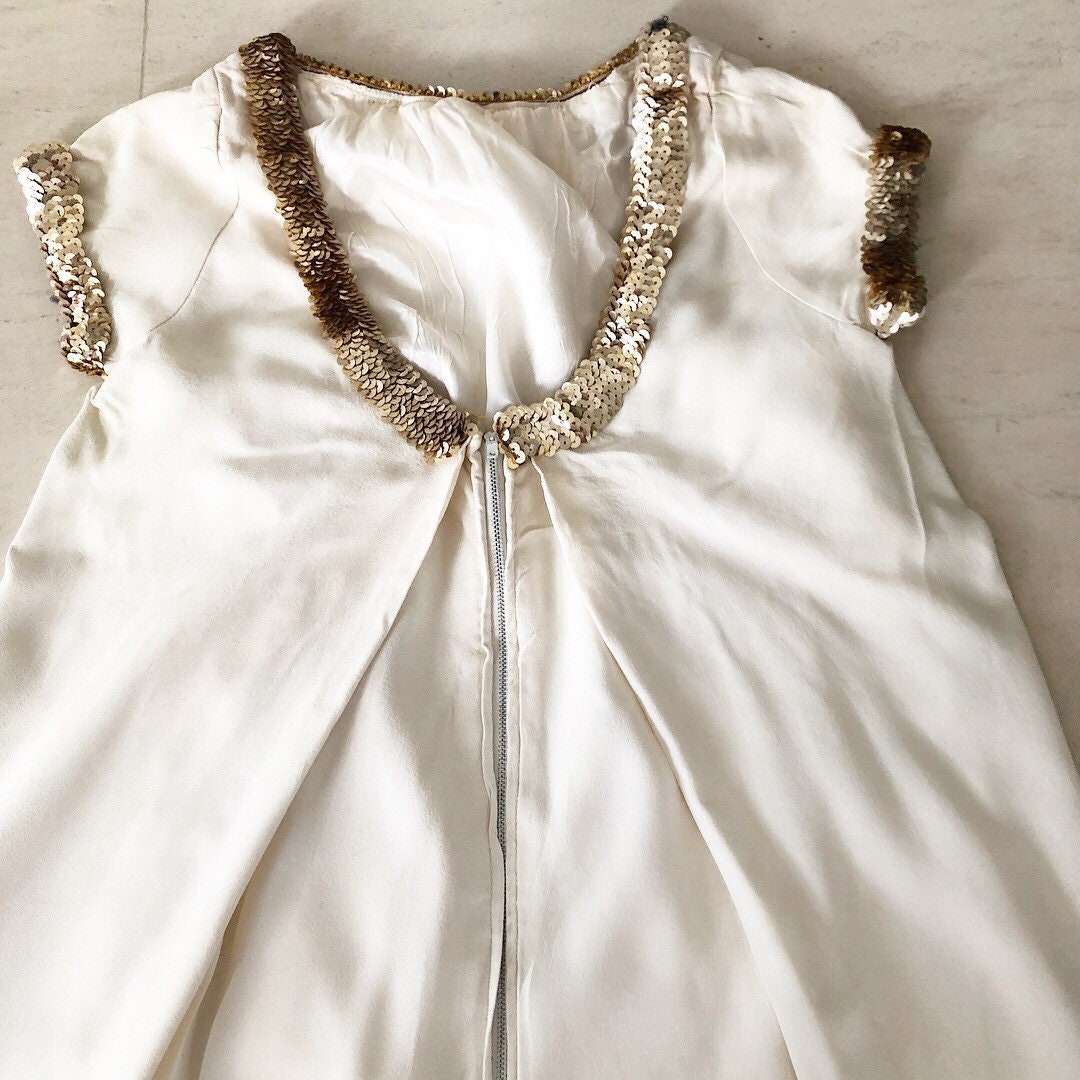 Vestido estilo babydoll dorado estilo años 60 de Glamazon