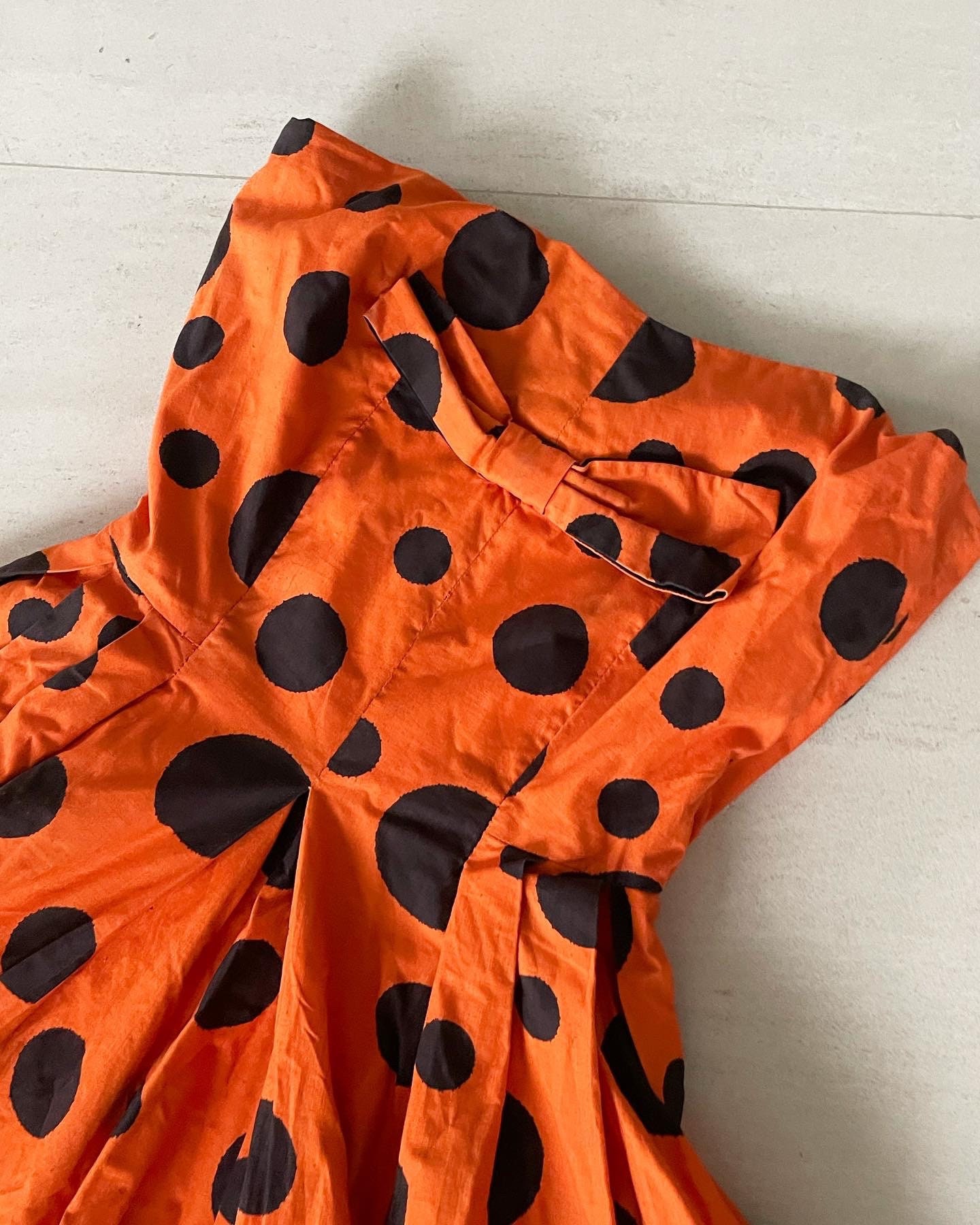Orange and black polka dot dress hotsell