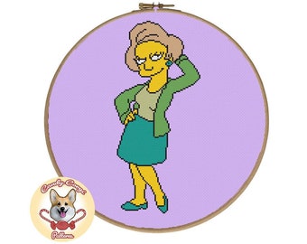 May include: Cross-stitch pattern featuring a cartoon character with yellow skin, green clothing, and a purple background. The character is a woman with a green skirt, a green jacket, and a yellow shirt. The pattern is for a round embroidery hoop.