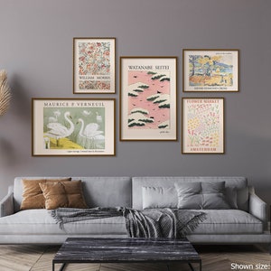May include: A living room interior with a gray sofa and a black coffee table. Five framed prints are hung on the wall above the sofa. The prints feature various designs, including floral patterns, landscapes, and birds. The prints are all in a similar style, with a vintage aesthetic.