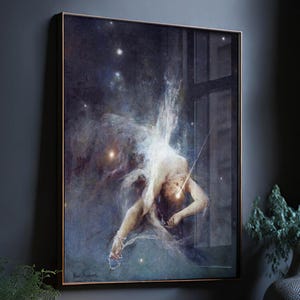 May include: A framed rectangular wall art print featuring a dark, celestial background with scattered white stars. A pale, ethereal figure is depicted in a dynamic, arched pose, surrounded by swirling, misty blue and grey clouds of cosmic dust.