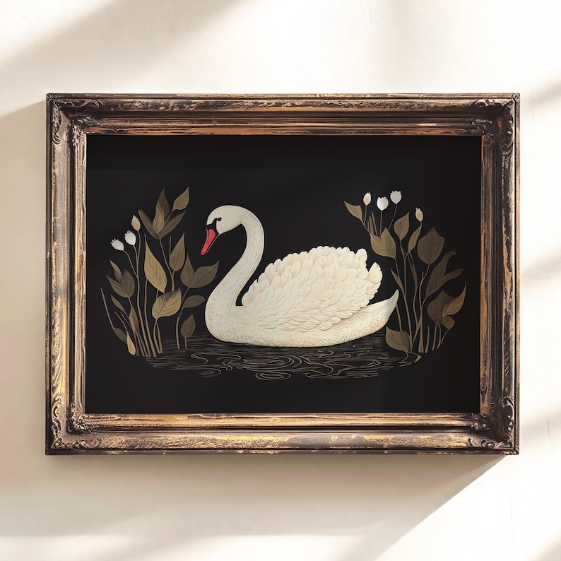 May include: A framed illustration of a white swan swimming in a pond with gold and green foliage. The swan has a red beak and white feathers. The background is black.