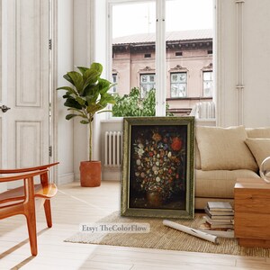 Peut inclure: Une peinture &agrave; l'huile encadr&eacute;e repr&eacute;sentant une nature morte avec un vase rempli de fleurs color&eacute;es. La peinture est sur un fond neutre et est encadr&eacute;e dans un cadre dor&eacute;.