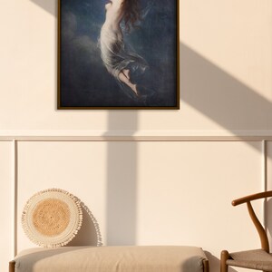 May include: A framed painting depicting a woman in a flowing white dress reaching up towards a bright light in a dark blue sky.