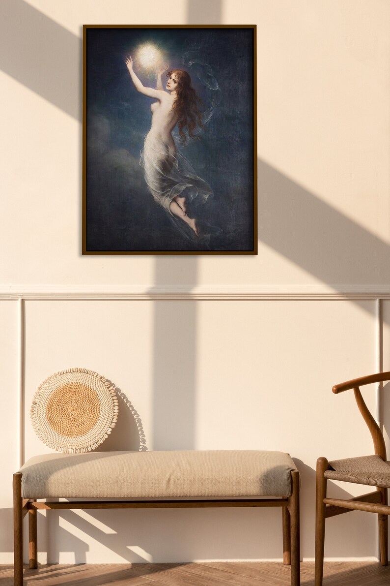 May include: A framed painting depicting a woman in a flowing white dress reaching up towards a bright light in a dark blue sky.