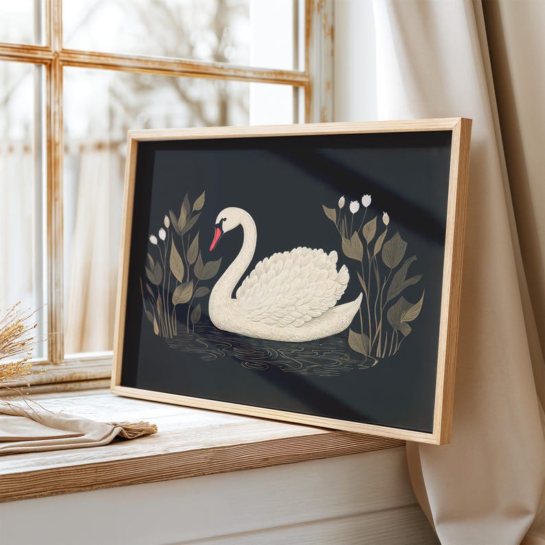 May include: A framed print of a white swan swimming in a dark blue pond with gold and green foliage. The swan has a red beak and white feathers.