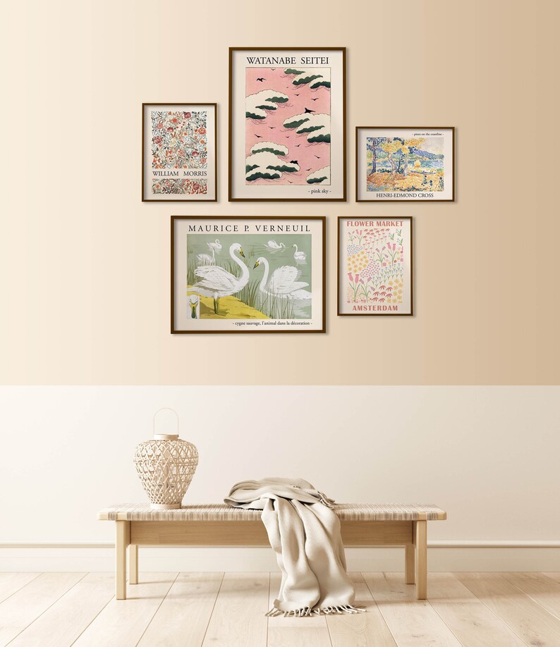 May include: Five framed art prints on a beige wall with a wooden bench and a woven lamp in front of the wall. The prints feature a variety of subjects, including flowers, birds, and landscapes. The prints are all in a similar style, with a vintage aesthetic.