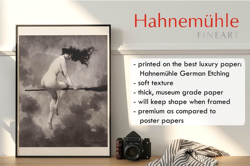 May include: A black and white print of a woman riding a broomstick. The print is framed and hanging on a wall. The text "Hahnem&uuml;hle FINEART" is visible in the upper right corner of the image. The text below the title describes the paper used for the print: "printed on the best luxury paper: Hahnem&uuml;hle German Etching soft texture thick, museum grade paper will keep shape when framed premium as compared to poster papers"