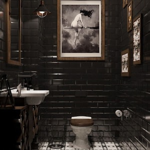 May include: A black and white checkered tile floor in a bathroom with a black tiled wall, a toilet, and a framed picture of a woman on a broomstick.