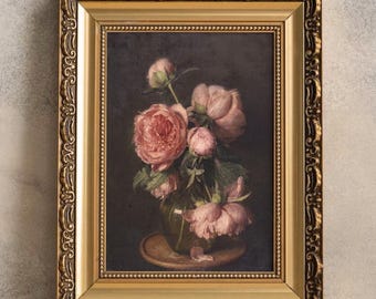 May include: A framed painting of a bouquet of pink peonies in a vase. The flowers are arranged in a vase on a table, and the background is a dark brown.