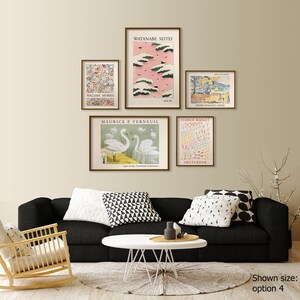 May include: Five framed art prints with different designs, including a floral print, a print of swans, a print of a flower market, a print of a pink sky with clouds, and a print of a landscape. The prints are arranged in a grid pattern on a beige wall above a black couch.