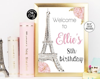 May include: A printable sign with a pink and gold Eiffel Tower design. The sign says "Welcome to Ellie's 8th birthday".