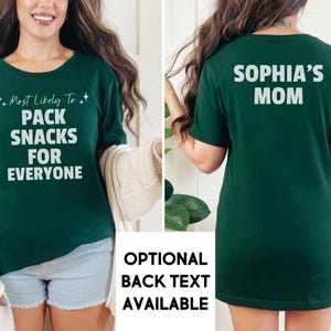 May include: A green t-shirt with the text "Most Likely To: Pack Snacks For Everyone" on the front and "Sophia's Mom" on the back.