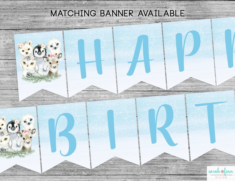 May include: A blue and white banner with the words "Happy Birthday" in blue letters. The banner features a wintery design with snowflakes and a watercolor background. The banner is decorated with cute animal illustrations, including an owl, a penguin, a deer, and a polar bear.