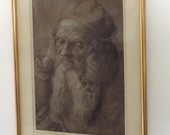 May include: A framed black and white drawing of an older man with a long beard and a hat. The man is looking down and his face is partially obscured by his beard.