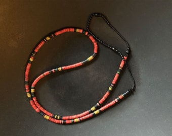 Necklace of old vulcanite African heishi beads with matte black glass