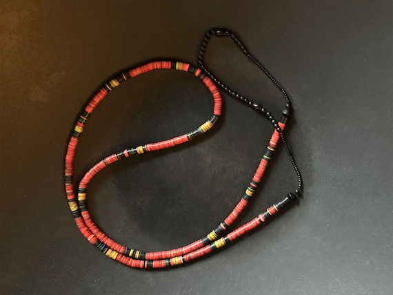 Necklace of old vulcanite African heishi beads with matte black glass