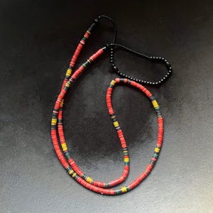 Necklace of old vulcanite African heishi beads with matte black glass