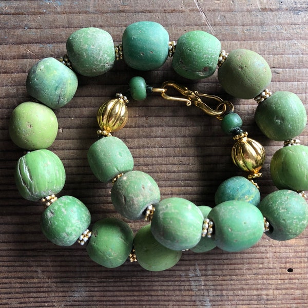 Necklace of ancient Jatim beads in soft greens, gently graduated, elegant, with vintage gold plated Bali silver