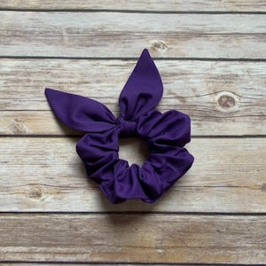 Coletero morado con lazo de orejas de conejo