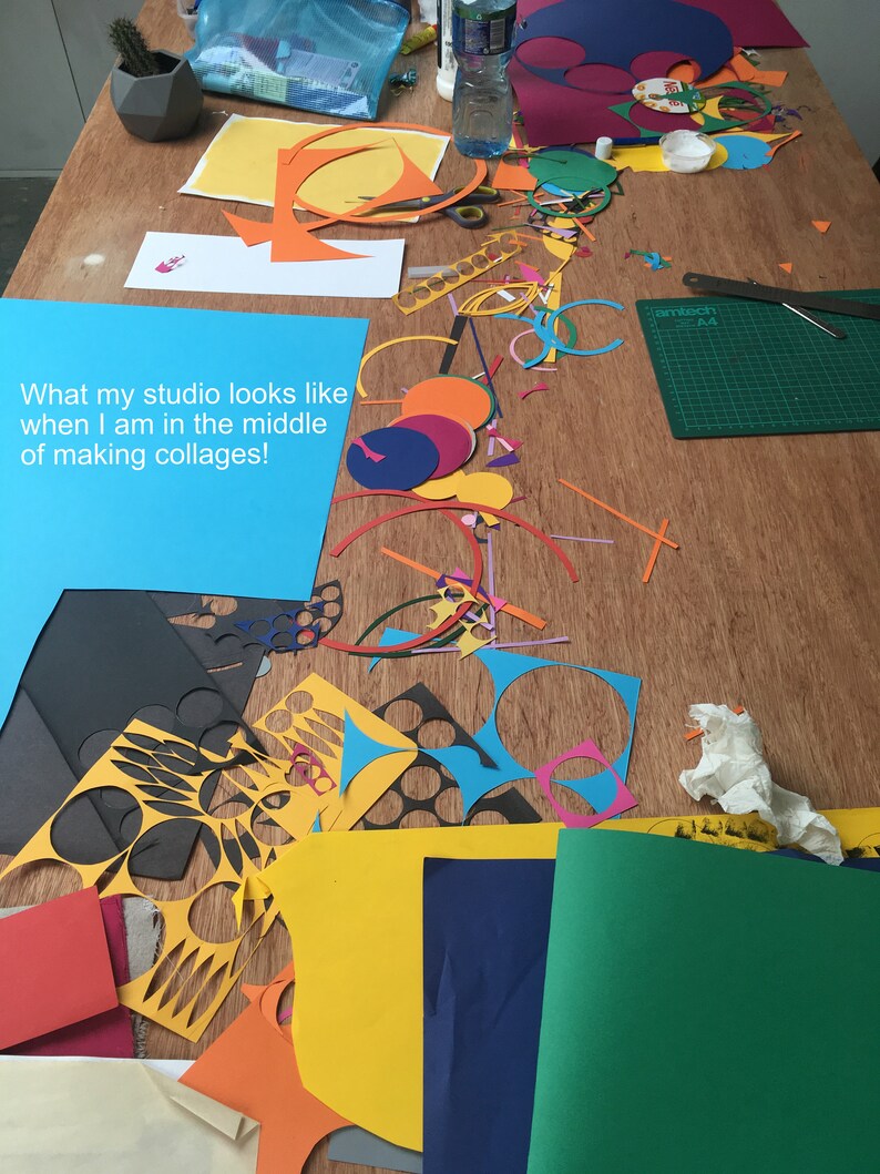 May include: A table covered in colorful paper scraps, including circles, squares, and rectangles, with a note that reads "What my studio looks like when I am in the middle of making collages!"