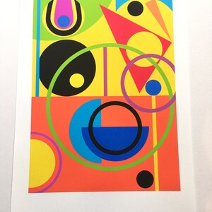 May include: Abstract geometric art print featuring a colorful composition of circles, squares, and triangles in shades of red, yellow, green, blue, black, and purple.